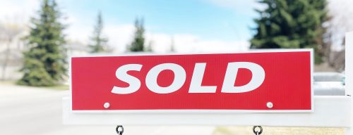 Sold sign on a house in a hot real estate market